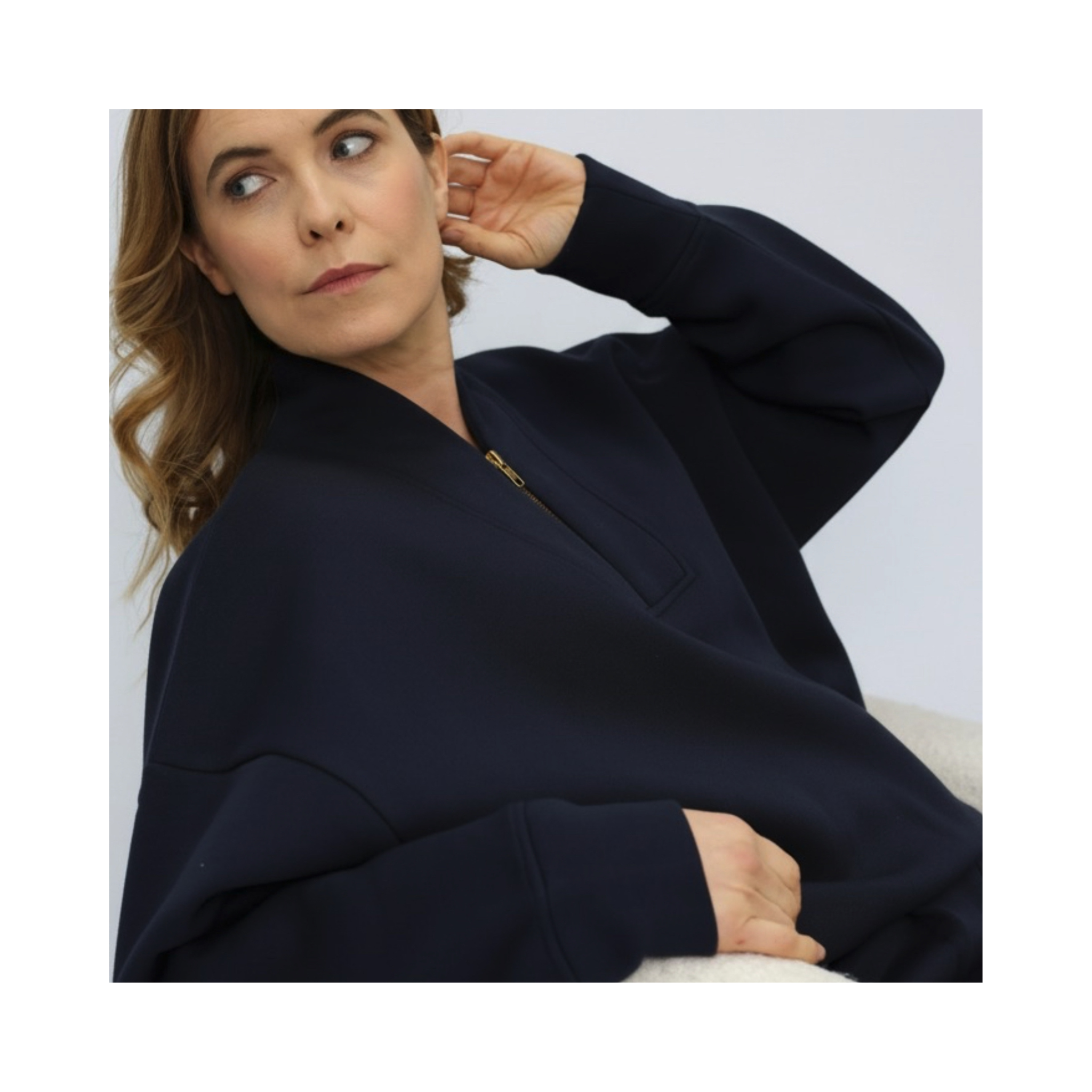 Navy blue sweatshirt with brass zip