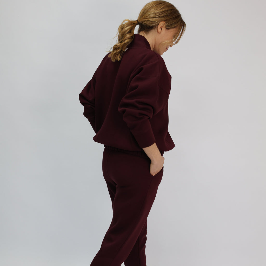 Back view of burgundy sweatshirt and matching joggers