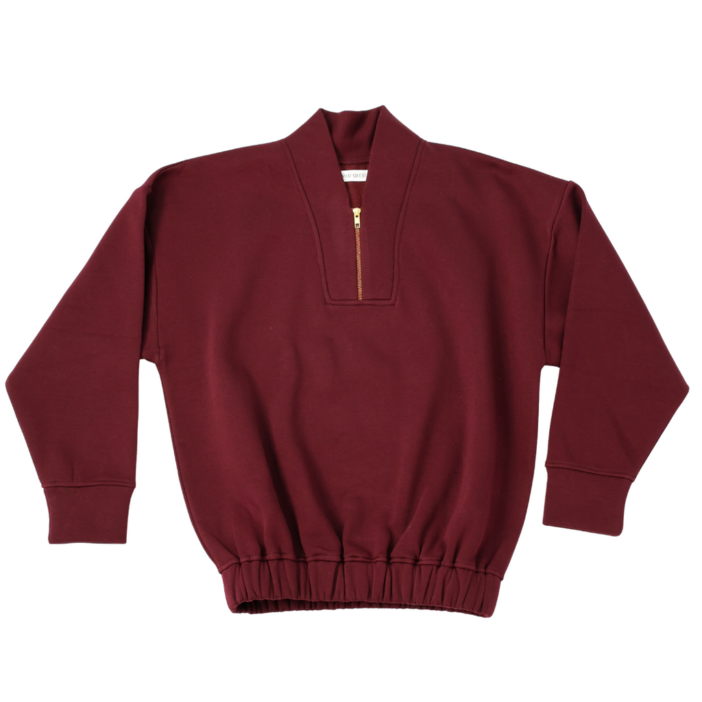 Flat lay of burgundy sweatshirt