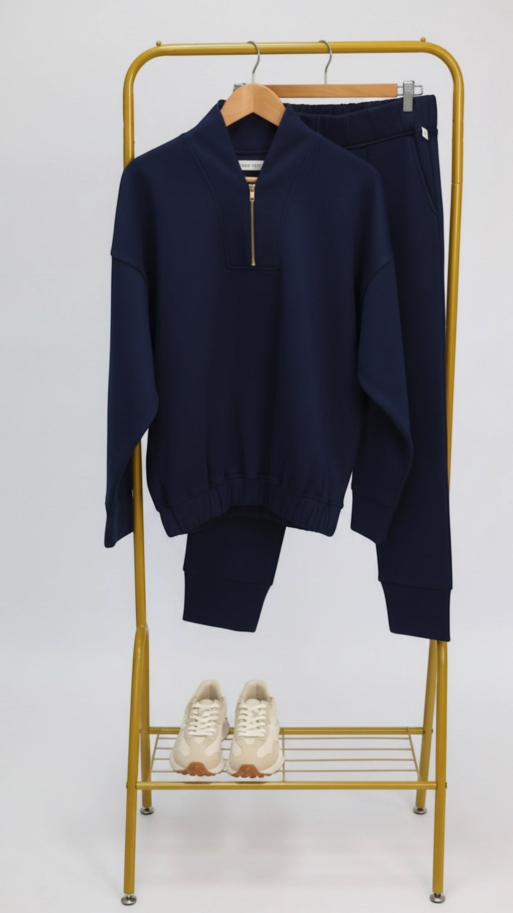 Wild Geese navy blue cotton fleece-lined cigarette sweatpants with front pleats and tapered legs.